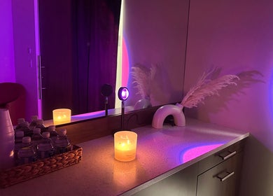 Inviting candlelit vanity at Sabrina Beauty, Lincoln Park, Michigan, US, exuding relaxation and comfort.
