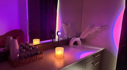 Inviting candlelit vanity at Sabrina Beauty, Lincoln Park, Michigan, US, exuding relaxation and comfort.