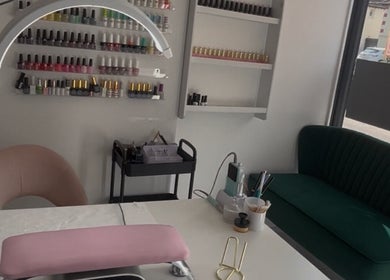 Leannasnailart salon in Dagenham, England, GB, featuring a stylish nail bar with polish display and modern seating.