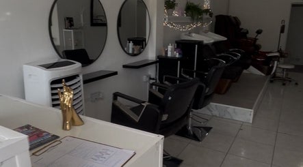 Stylish salon interior at Leannasnailart, Dagenham, England, GB featuring modern chairs and mirrors.