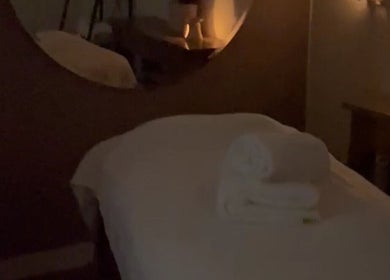 Relaxing massage room at Beautybysxph, Hamilton, Scotland, GB with gentle lighting and fresh towels.