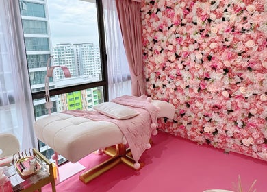 Luxurious massage room with pink floral decor at Beauty Oasis, Singapore, Singapore, SG.