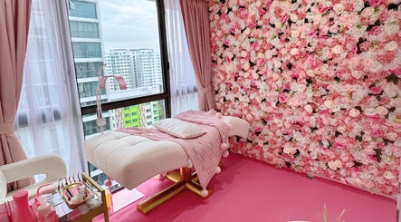 Luxurious massage room with pink floral decor at Beauty Oasis, Singapore, Singapore, SG.