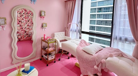 Chic spa room at Beauty Oasis with floral decor in Singapore, Singapore, SG, featuring a plush massage bed.