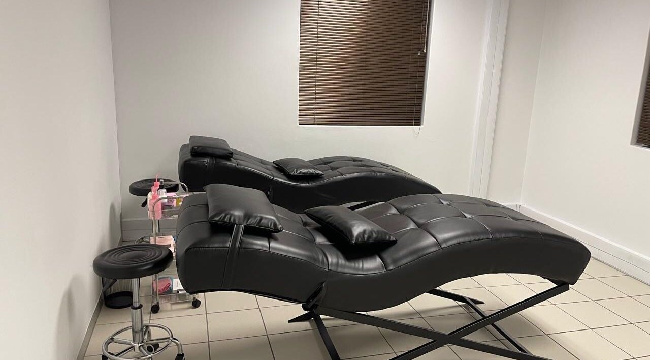 Comfortable black leather loungers at LedyLux Beauty in Johannesburg, Gauteng, ZA.
