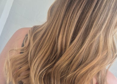 Lustrous blonde hair styled in waves at Hair by Chantelle, Worcester, England, GB.
