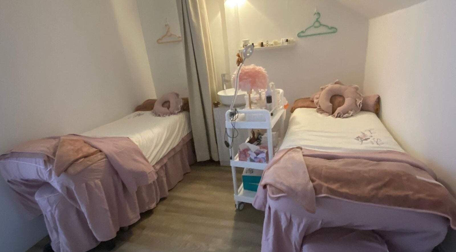 Tranquil treatment room at Fannel De Beaute, Singapore, SG, featuring two cozy beds for ultimate relaxation.