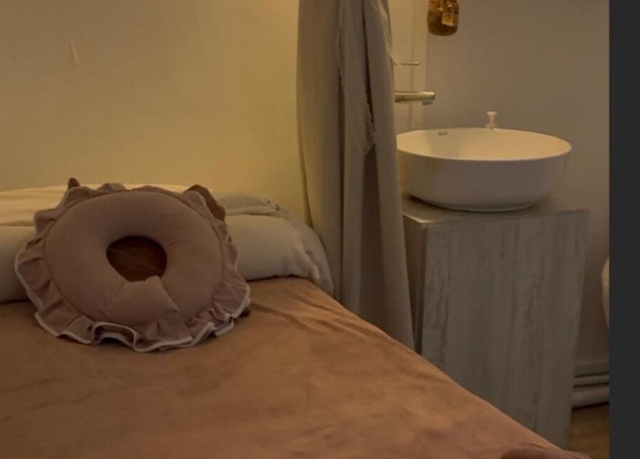 Relaxing massage room at Fannel De Beaute, Singapore, SG, featuring calming decor and elegant fixtures.