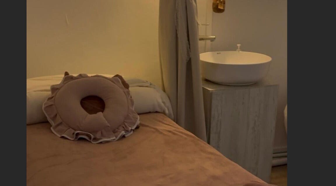 Relaxing massage room at Fannel De Beaute, Singapore, SG, featuring calming decor and elegant fixtures.