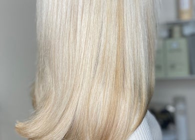Blonde hair with a sleek finish at ellielouisehair in Hinckley, England, GB, showcasing expert hairdressing.