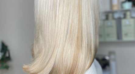 Blonde hair with a sleek finish at ellielouisehair in Hinckley, England, GB, showcasing expert hairdressing.