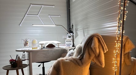 Inviting nail treatment area at RosaGink, Cork, County Cork, IE with soft lighting and plush seating.