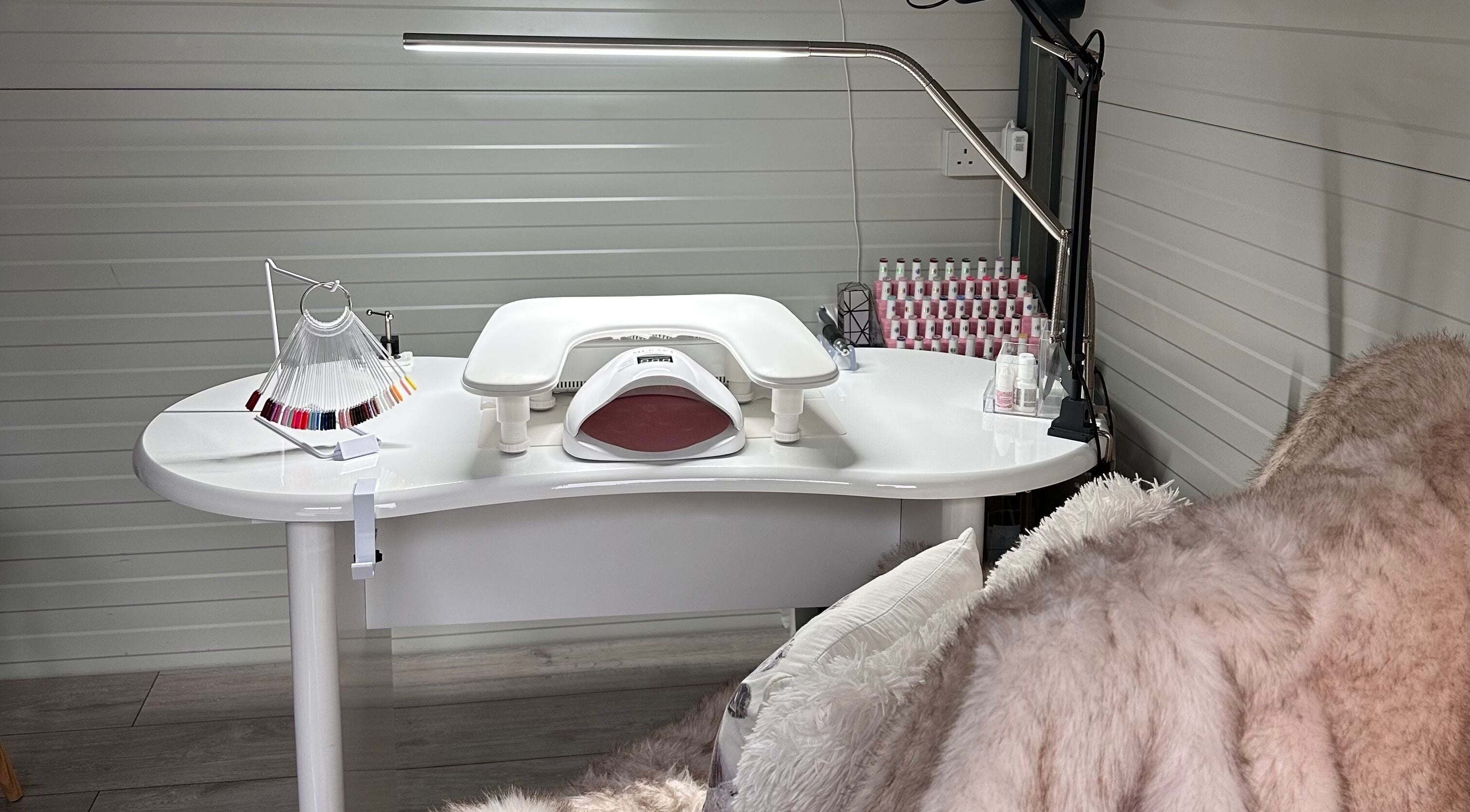 Modern nail station at RosaGink, Cork, County Cork, IE, featuring elegant decor and nail polish selection.