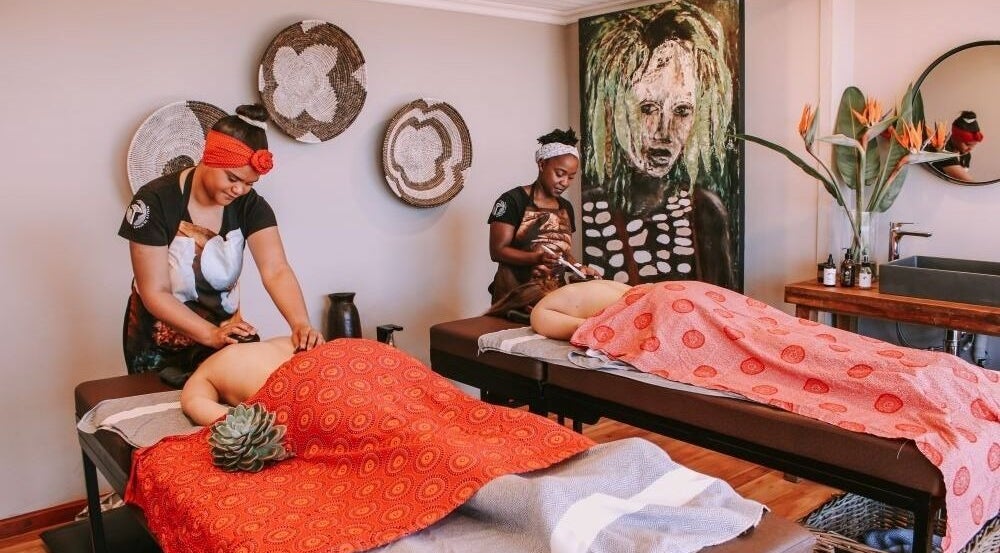 Therapists provide massages at Touch by Africa Zevenwacht, Cape Town, Western Cape, ZA in a soothing ambiance.