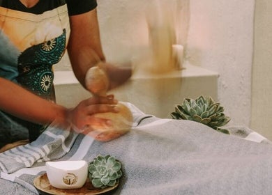 Therapist giving a calming massage at Touch by Africa Zevenwacht, Cape Town, Western Cape, ZA.