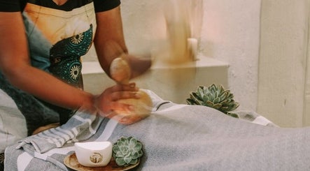 Therapist giving a calming massage at Touch by Africa Zevenwacht, Cape Town, Western Cape, ZA.