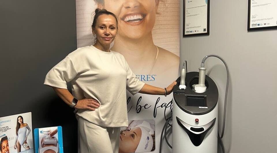 Expert at Harmony Beauty Studio in Arklow, County Wicklow, IE, showcasing advanced skincare equipment.