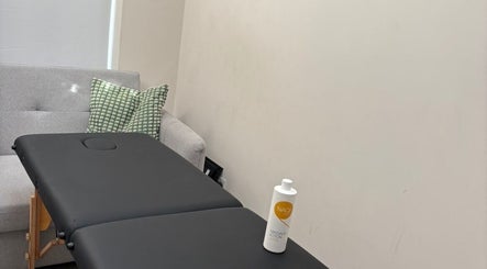 Lynam Performance & Recovery massage table in Dublin, County Dublin, IE, with cushion and lotion.