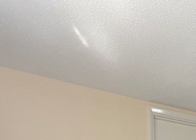 Smooth ceiling detail at BRAIDS by MJ, Maidstone, England, GB, showcasing a serene ambiance.