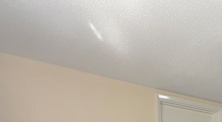 Smooth ceiling detail at BRAIDS by MJ, Maidstone, England, GB, showcasing a serene ambiance.