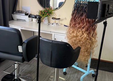 BRAIDS by MJ salon in Maidstone, England, showcasing professional styling setup and equipment.