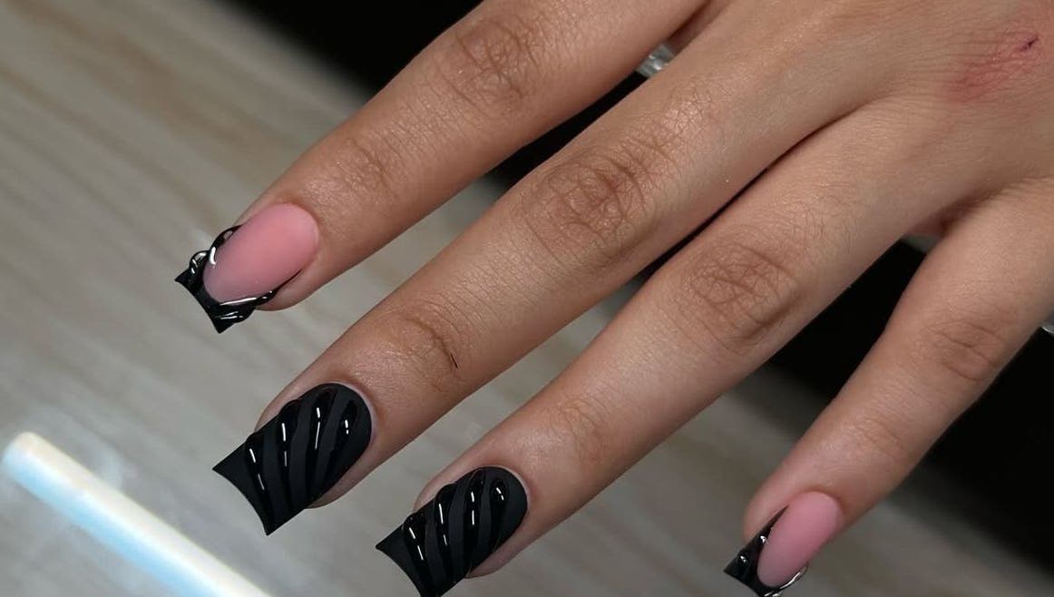 Elegant black nail art at Beauty Glamorous Nails, Kralendijk, Bonaire, BQ. Stylish manicure with intricate design.