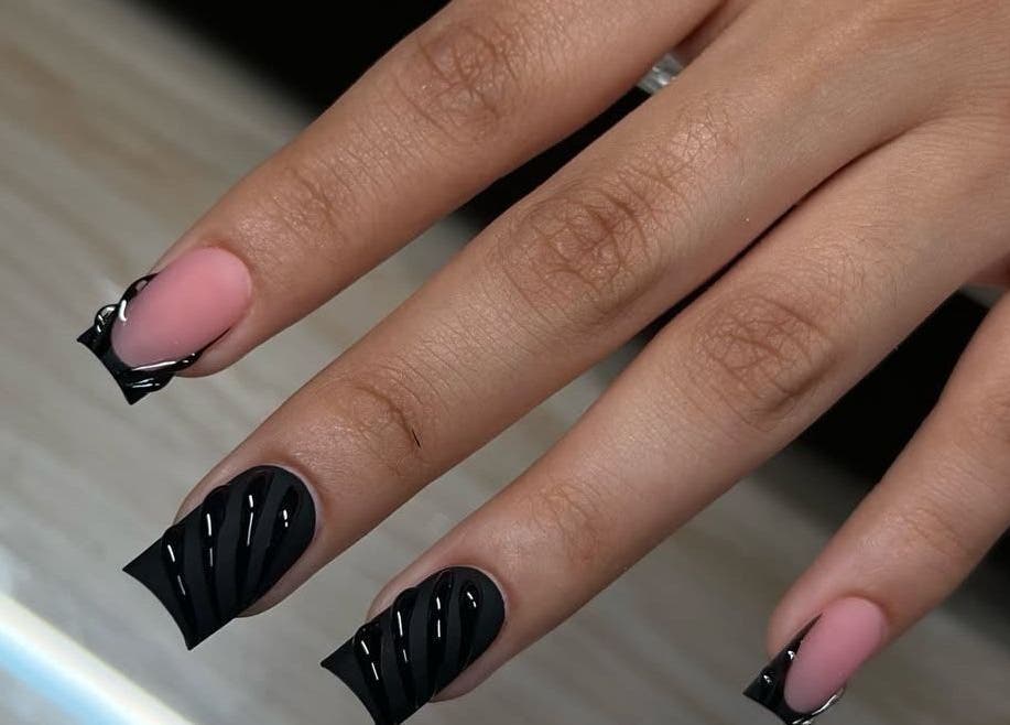 Elegant black nail art at Beauty Glamorous Nails, Kralendijk, Bonaire, BQ. Stylish manicure with intricate design.