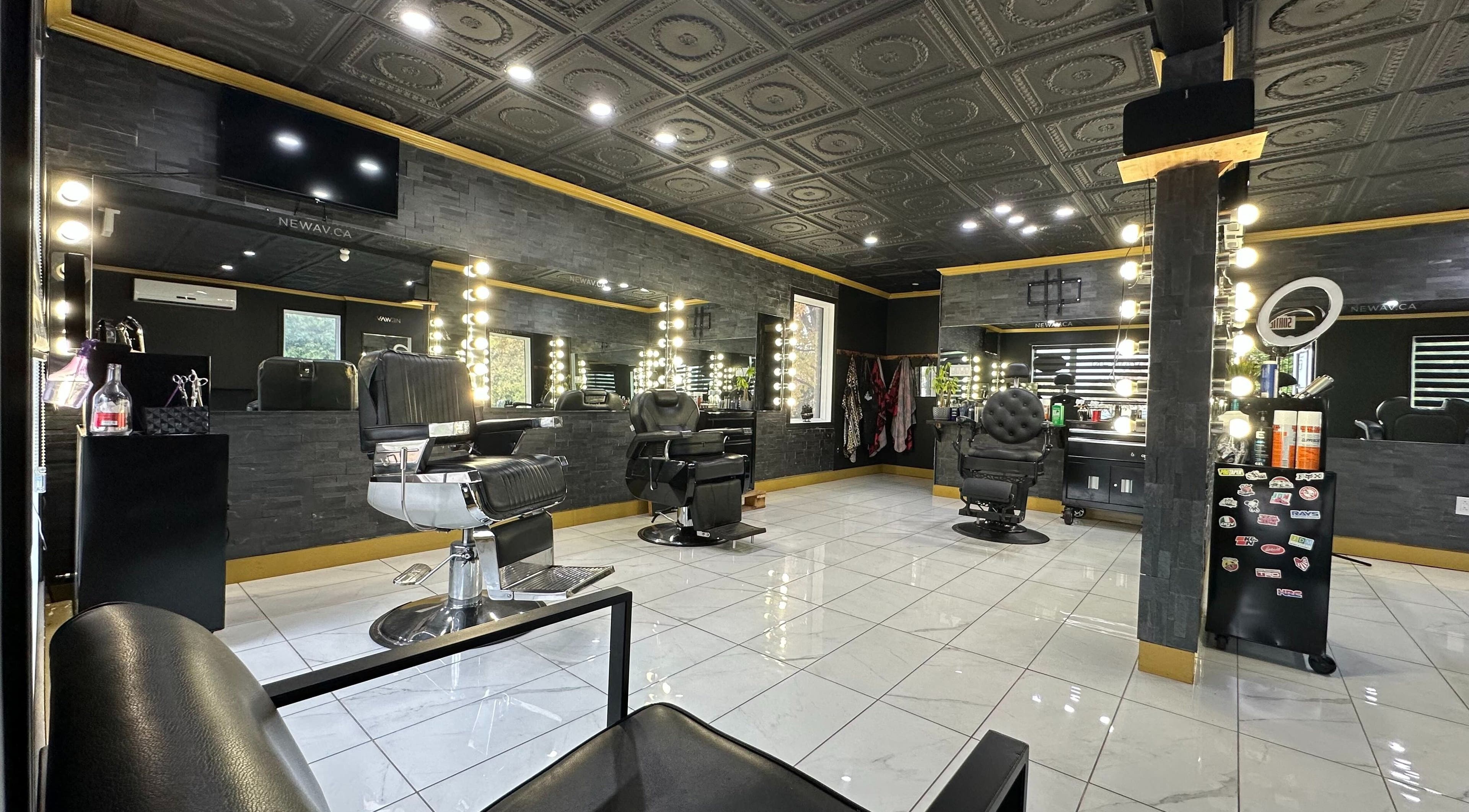 Luxurious salon interior at Newav Saint-Rémi, featuring modern chairs and mirrors in Saint-Rémi, Quebec, CA.