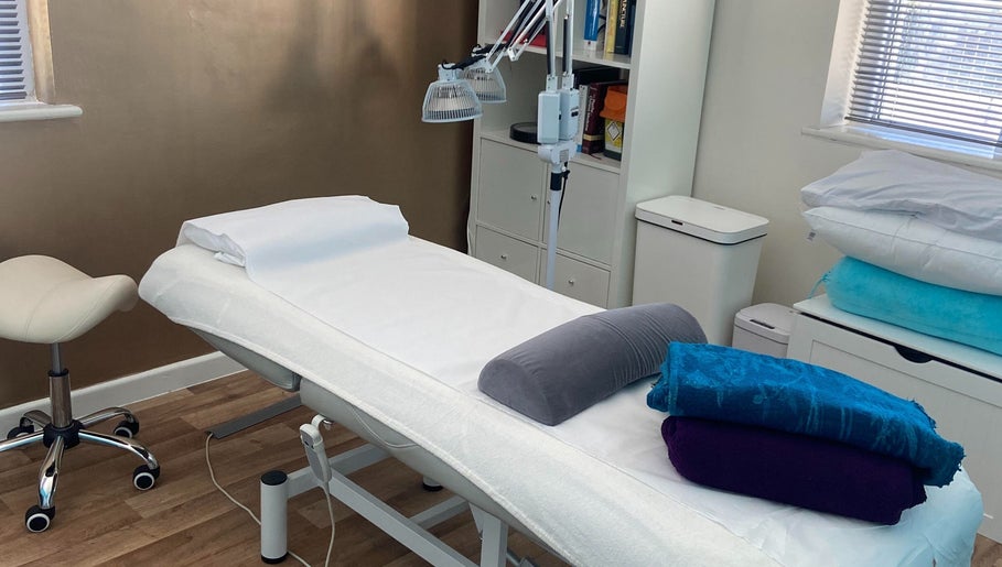 Cozy therapy room at Michelle Denise Craniosacral Therapy Somerton, Somerton, England, GB with massage table.