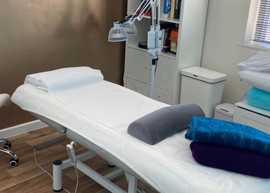 Cozy therapy room at Michelle Denise Craniosacral Therapy Somerton, Somerton, England, GB with massage table.