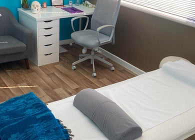 Therapy room at Michelle Denise Craniosacral Therapy Somerton in Somerton, England, GB with treatment bed and desk.