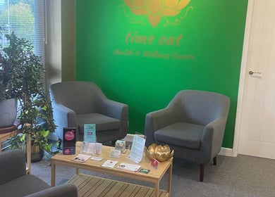 Cozy seating area at Michelle Denise Craniosacral Therapy Somerton, Somerton, England, GB with green walls.