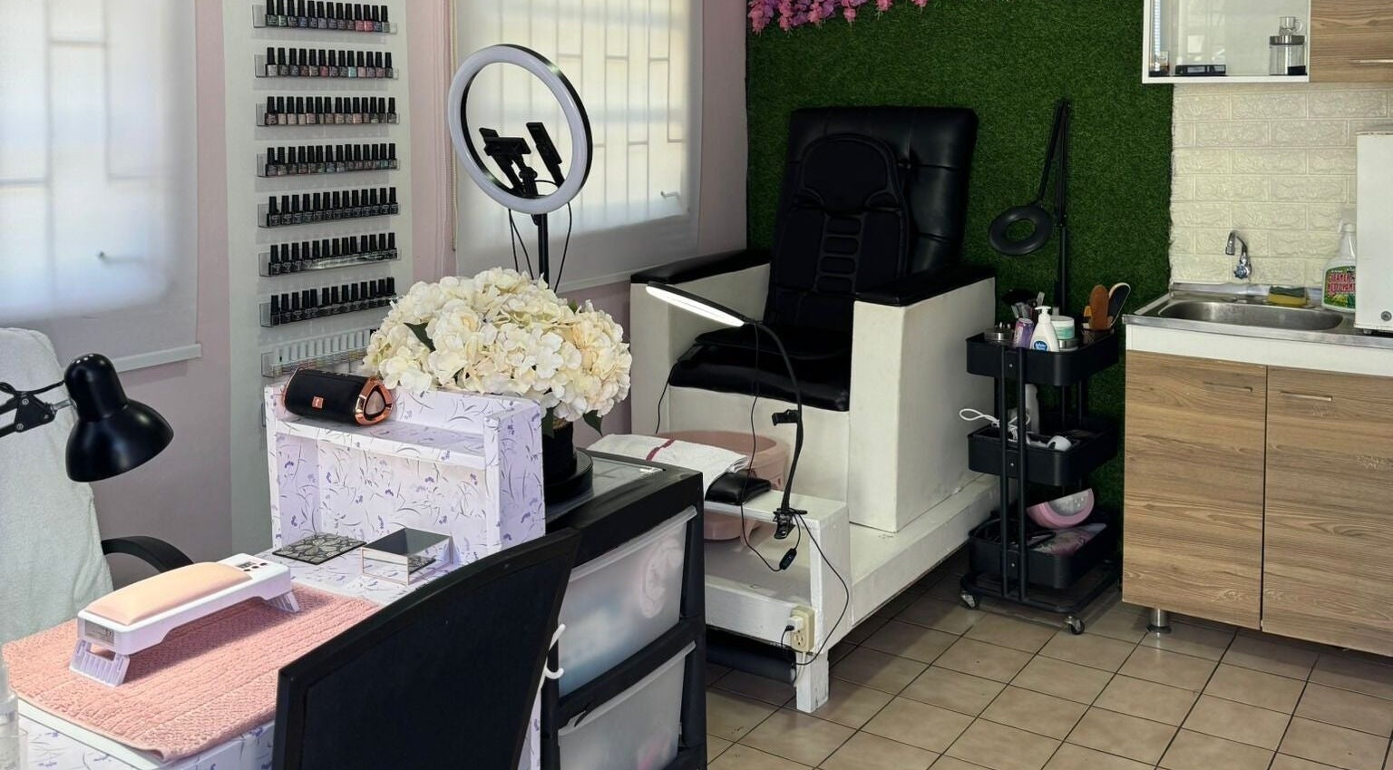 Cozy nail salon at Elegant Touch By Lia's Nails in Willemstad, Curaçao, CW with manicure station and floral decor.