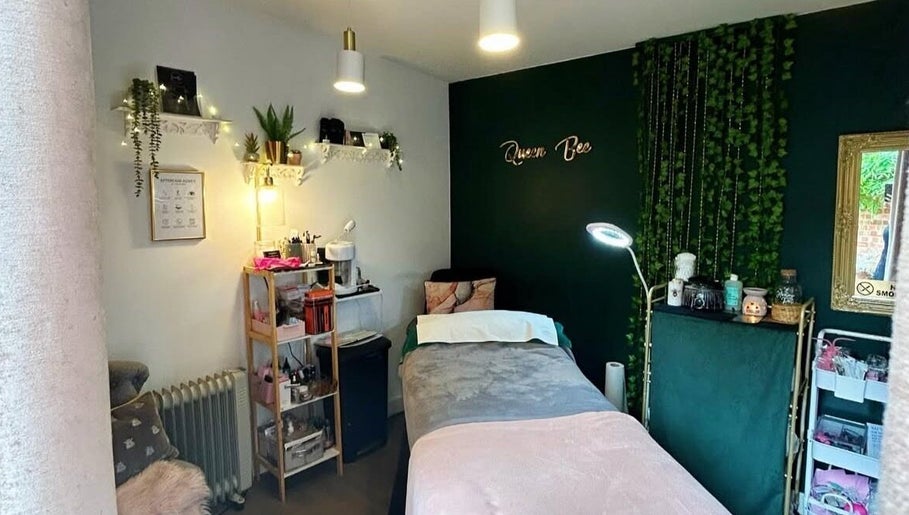 Relaxing treatment room at Queen Bee Beauty Enhancement, Donington, England, GB, with ambient decor and lighting.