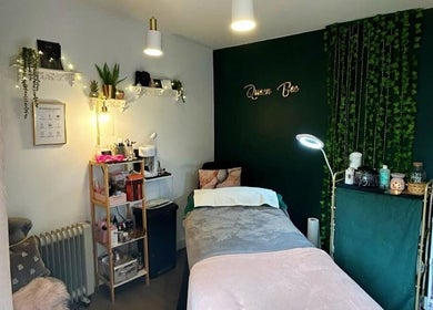 Relaxing treatment room at Queen Bee Beauty Enhancement, Donington, England, GB, with ambient decor and lighting.