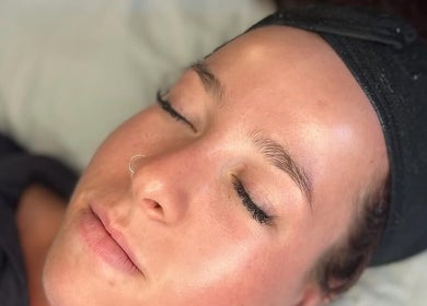 Relaxed client with glowing skin at Queen Bee Beauty Enhancement, Donington, England, GB.