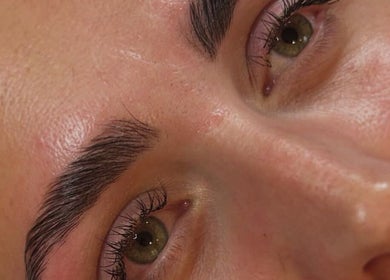 Close-up of enhanced eyebrows and eyes at Queen Bee Beauty Enhancement in Donington, England, GB.