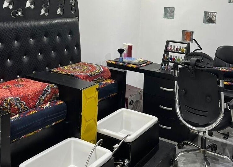 Luxury pedicure setup at ErojaHive, Lagos, Lagos, NG, featuring plush seating and elegant decor.