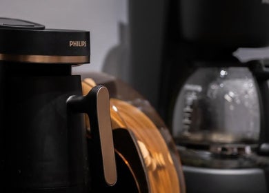 Philips coffee makers at Dazzle Code Barber, الرياض, منطقة الرياض, SA, creating a welcoming ambiance.