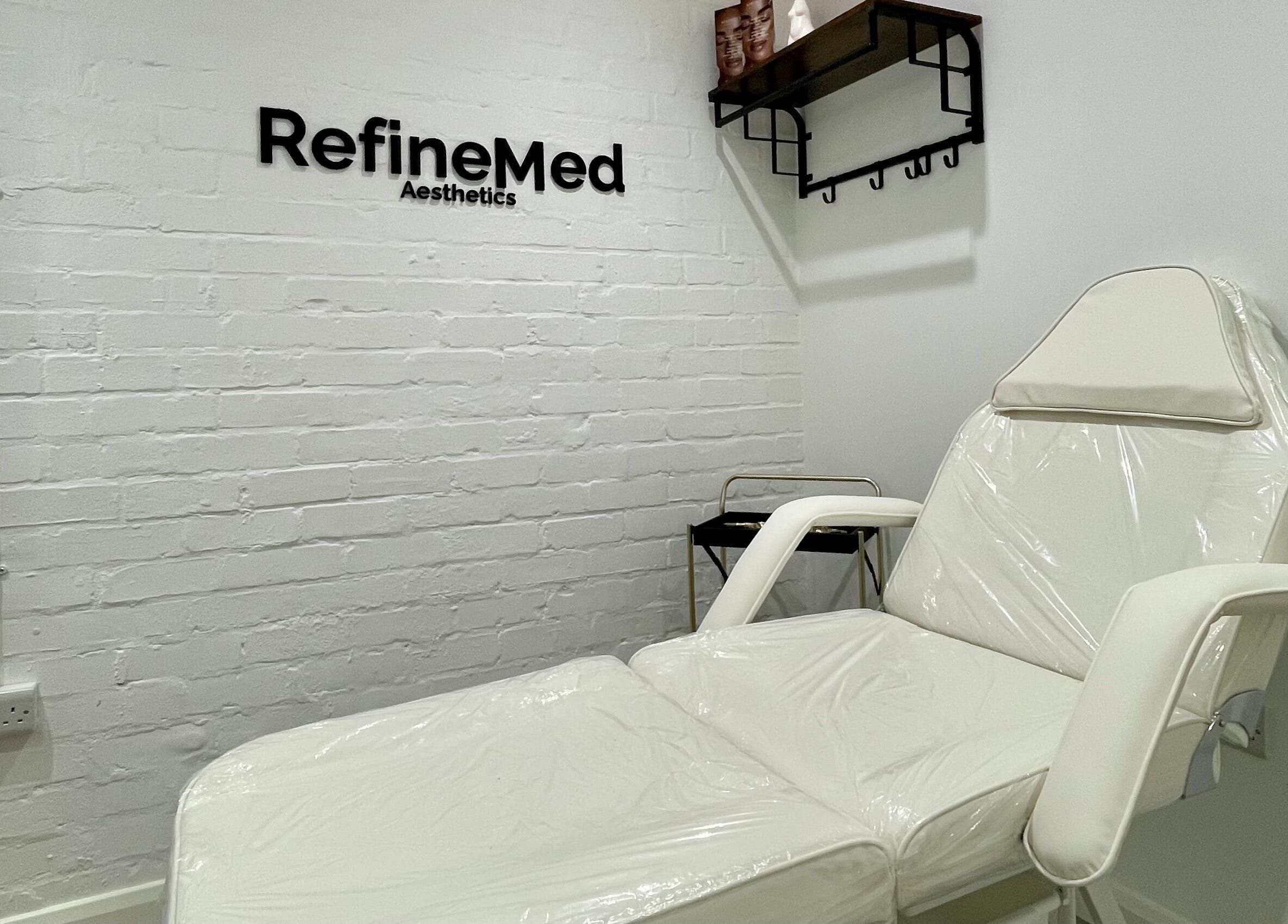 RefineMed Aesthetics treatment room in Newcastle upon Tyne, England, GB featuring modern white furniture.