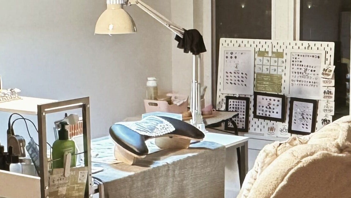 Nail workstation at JasNail Studio, Halifax, Nova Scotia, CA, showcasing tools and a relaxing chair.