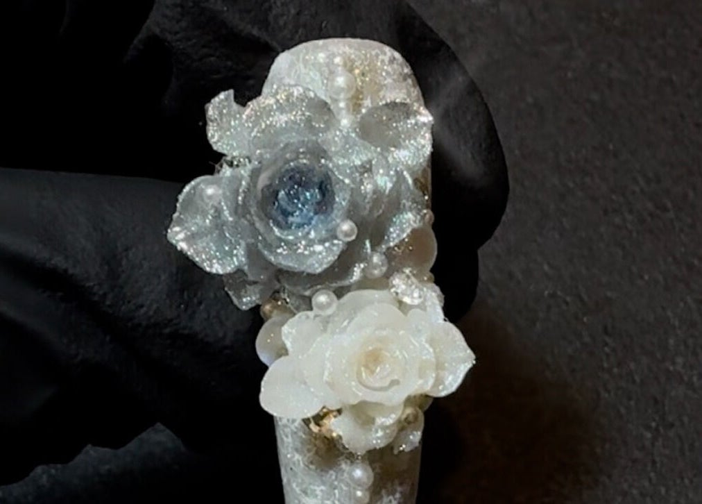 Intricate floral nail art at JasNail Studio, Halifax, Nova Scotia, CA, featuring white roses and shimmering accents.