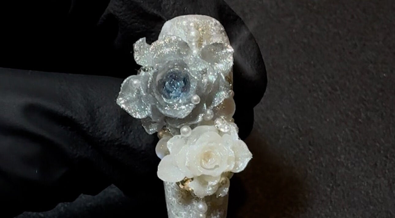 Intricate floral nail art at JasNail Studio, Halifax, Nova Scotia, CA, featuring white roses and shimmering accents.