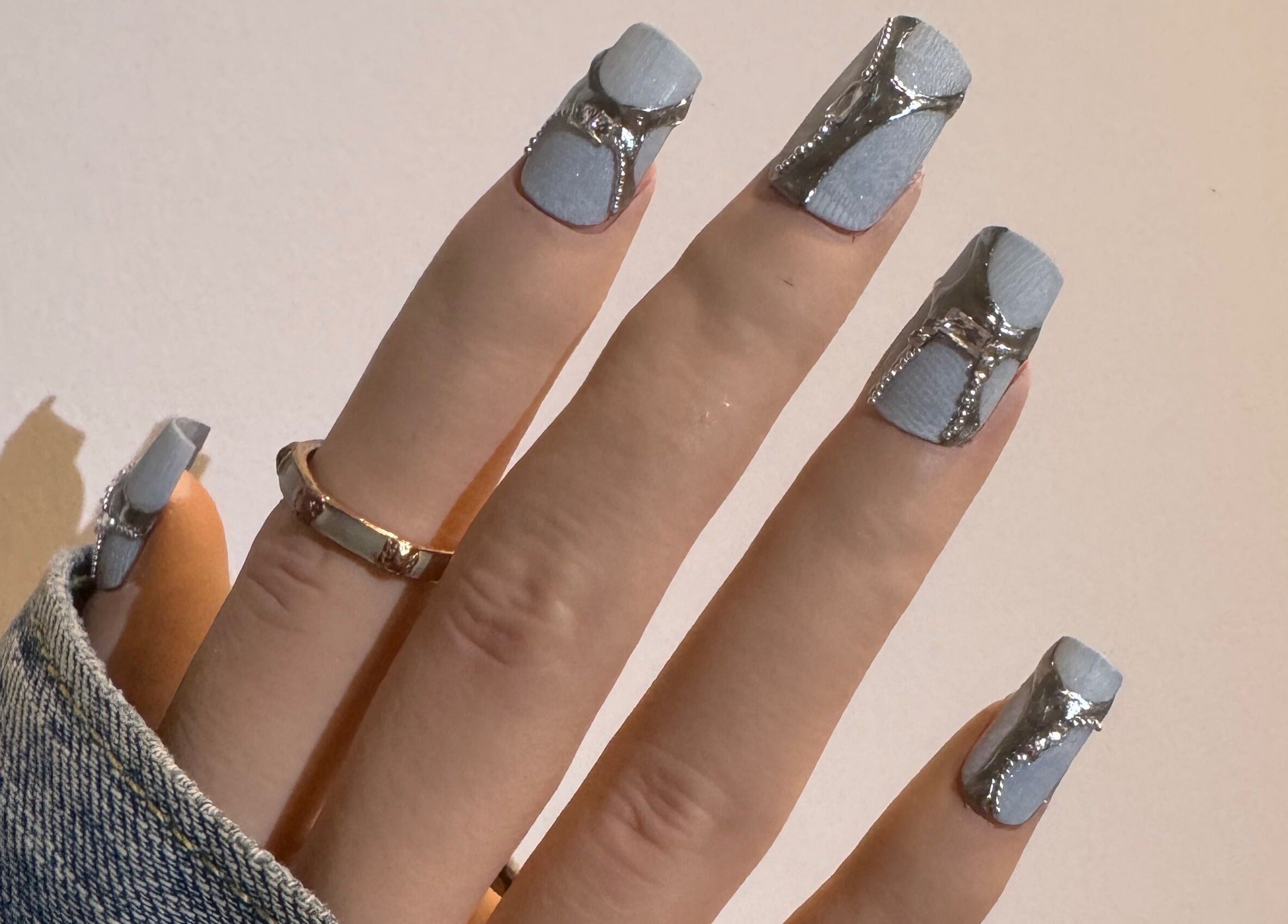 Stylish silver-accented nails at JasNail Studio, Halifax, Nova Scotia, CA. Perfect for a chic look.