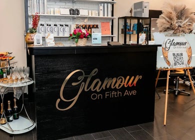 Luxurious reception area at Glamour on Fifth Ave, New York, New York, US, featuring elegant decor and refreshments.
