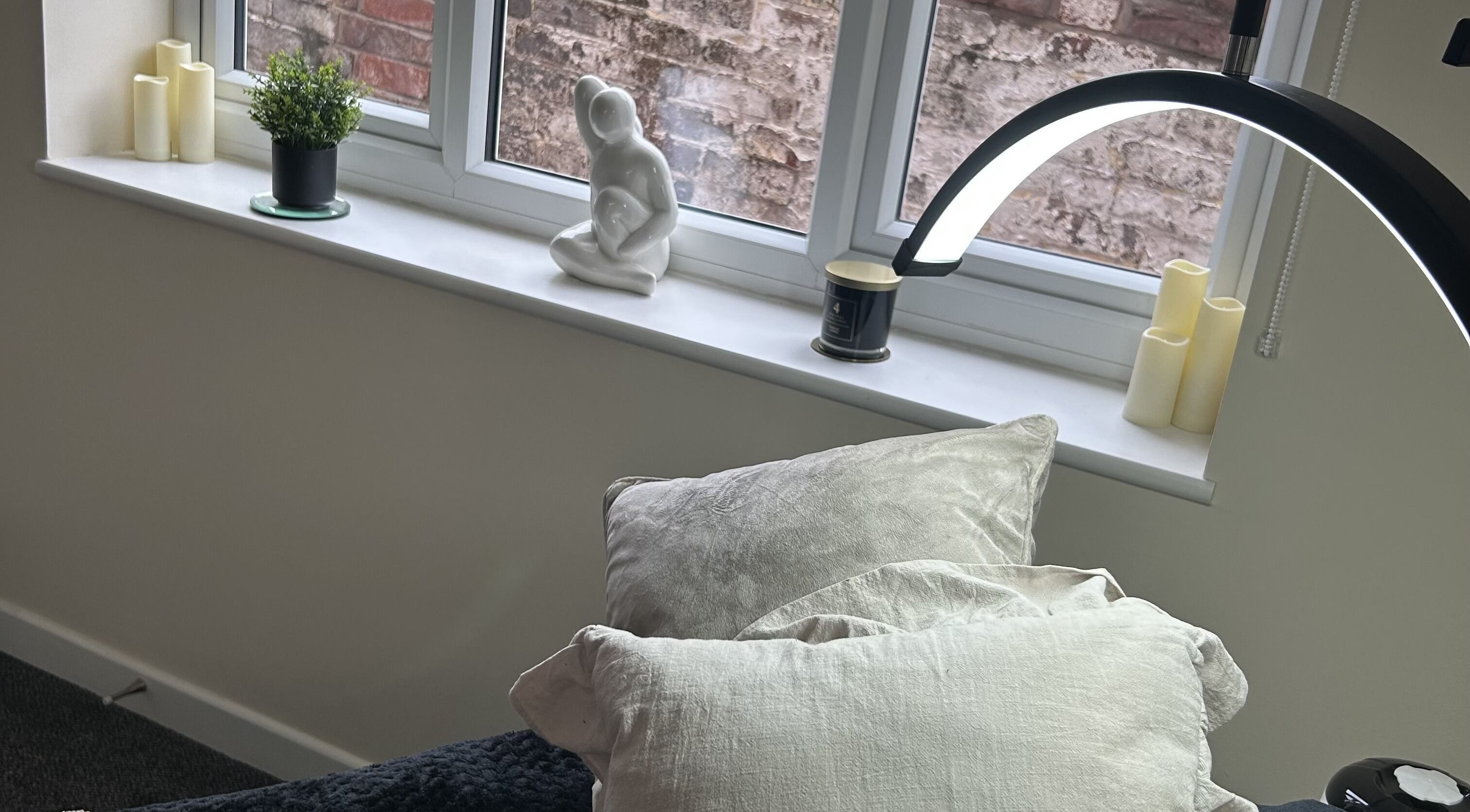 Cozy treatment room at The Retreat at Salon Nine in Stone, England, GB with elegant decor and natural light.