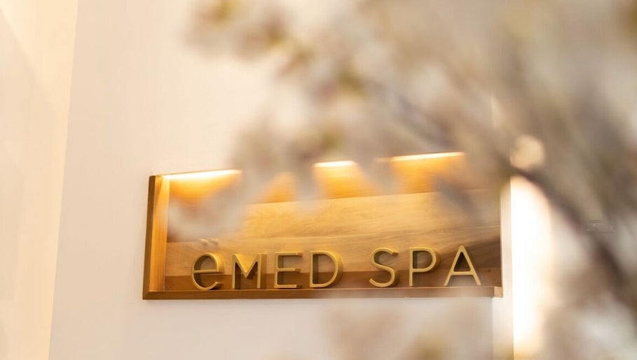 Warm-lit ëMed Spa Jamaica LLC sign at Kingston, St. Andrew Parish, JM beautifully displayed in a serene setting.