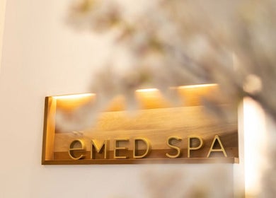Warm-lit ëMed Spa Jamaica LLC sign at Kingston, St. Andrew Parish, JM beautifully displayed in a serene setting.