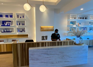 ëMed Spa Jamaica LLC reception area in Kingston, St. Andrew Parish, JM featuring elegant decor and products.