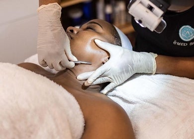 Client receiving a skin treatment at ëMed Spa Jamaica LLC, Kingston, St. Andrew Parish, JM.